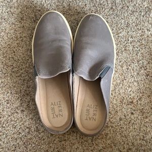 Naturalized gray slip-ons